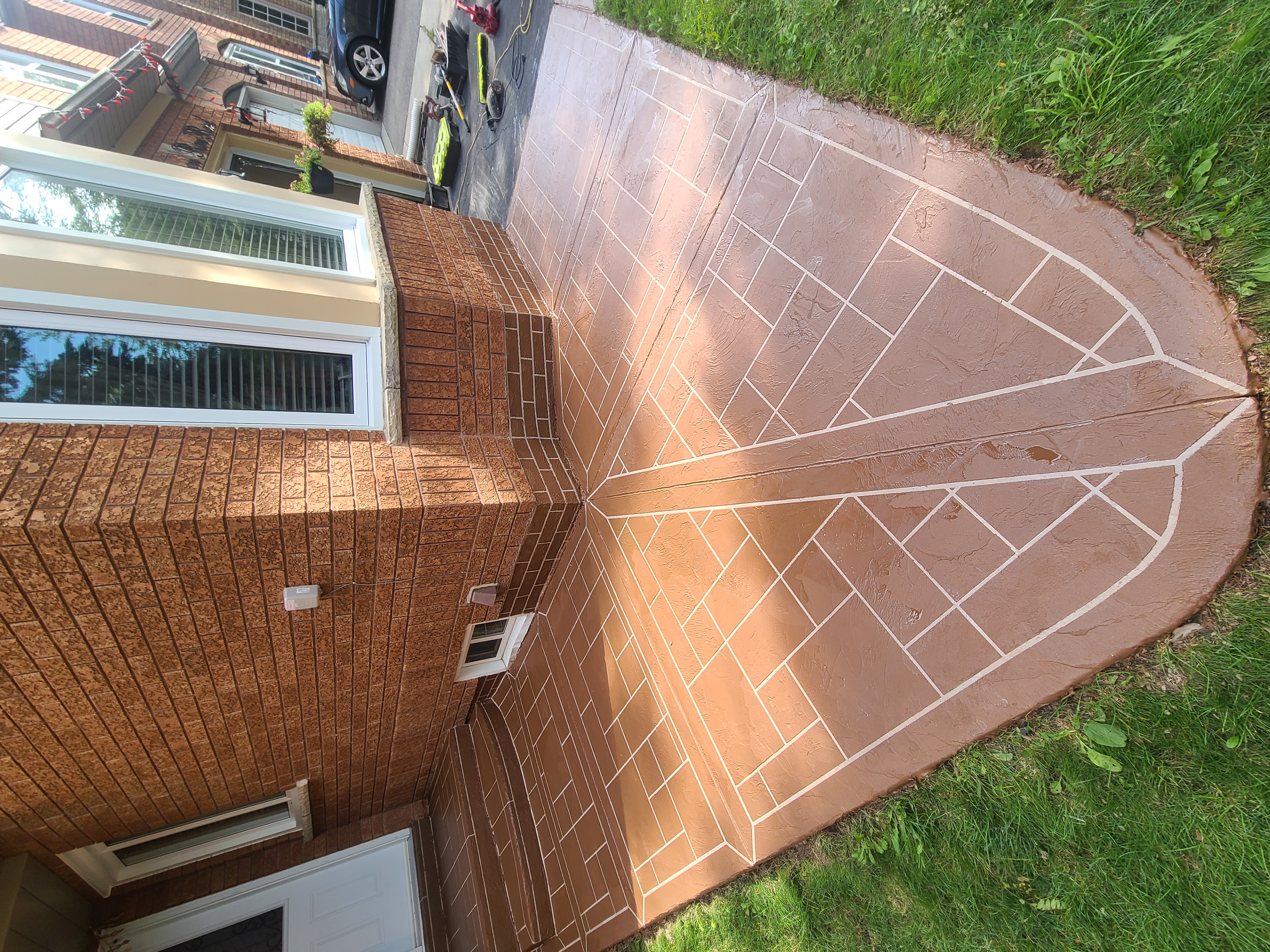 Brown Jewelstone concrete overlay around a front porch